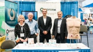 Ostoform team at exhibition booth