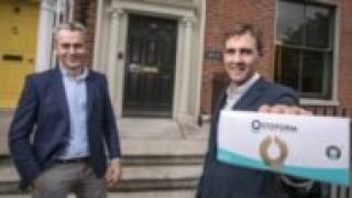 Kevin Kelleher CEO of Ostoform holding a box of the Ostoform Seal outside BGF building
